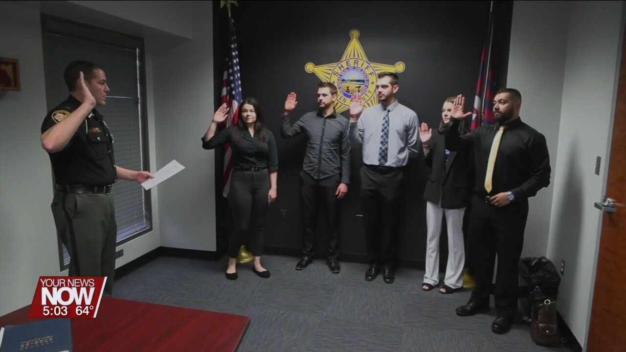 Five officers are sworn in as the first class of the new cadet program